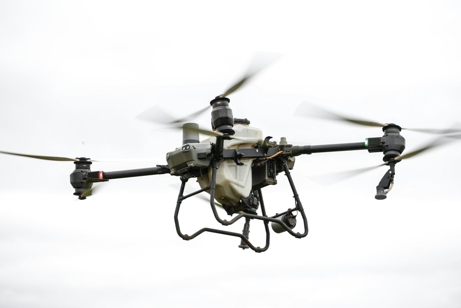 about-us High-resolution image of a specialized agricultural drone flying outdoors, showcasing modern farming technology.